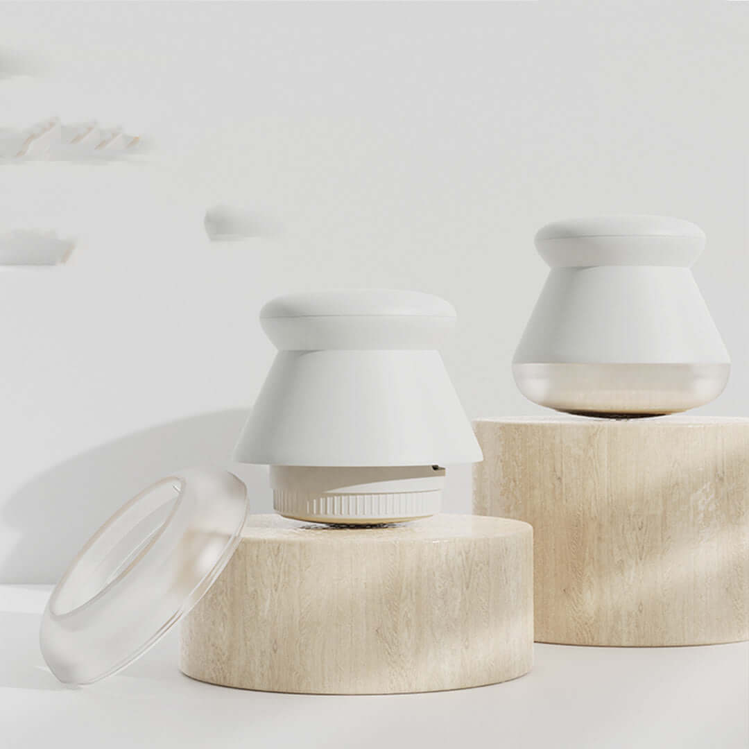 Rechargeable clothes hair remover in white on wooden pedestals, showcasing sleek design and modern aesthetic.