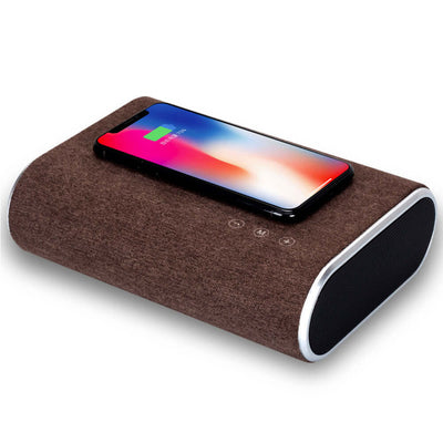 Wireless charger speaker in dark brown with smartphone, featuring Bluetooth, USB interface, and music enjoyment.