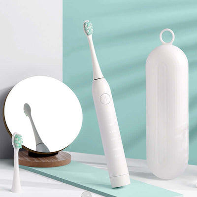 Sleek electric toothbrush with charging case and mirror, showcasing modern design in white and mint green.