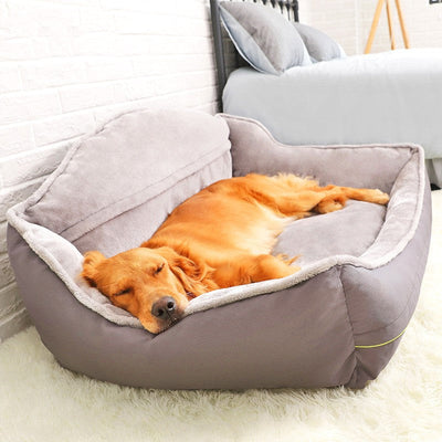 Large portable dog bed with a golden retriever sleeping comfortably, providing warmth and support.