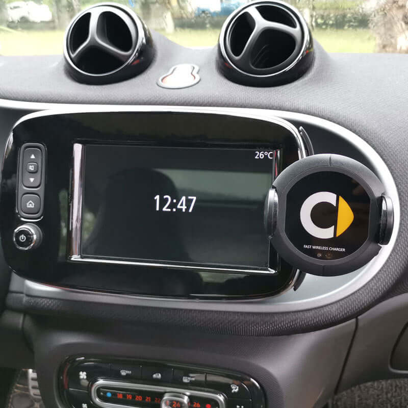 Car interior featuring a wireless charger mounted on dashboard with clock display, perfect for easy wireless charging.