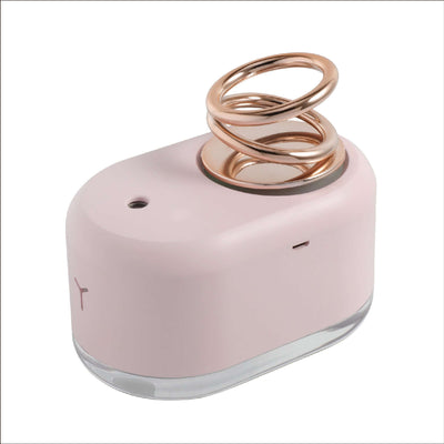Suspended double ring mini humidifier in pink with a gold spiral design, perfect for households in small areas.