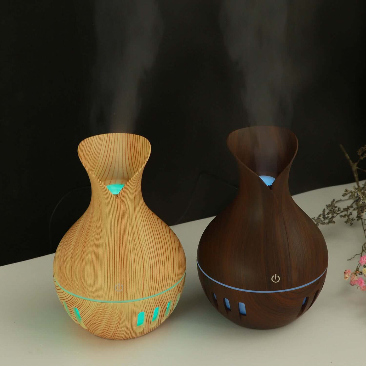 Hollow colorful mini USB humidifier in wood finish, with LED light and mist output, enhancing indoor air quality.