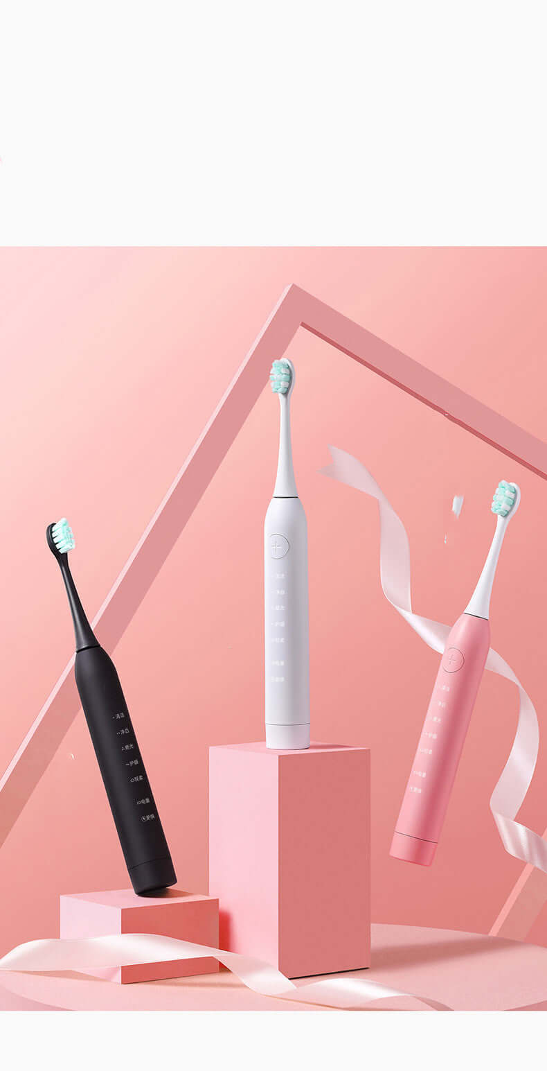 Three sonic electric toothbrushes in black, white, and pink on a pastel background, featuring modern design.