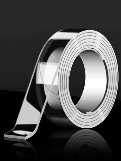 Clear double sided reusable tape roll on a black background, perfect for multi-surface adhesion and eco-friendly use.