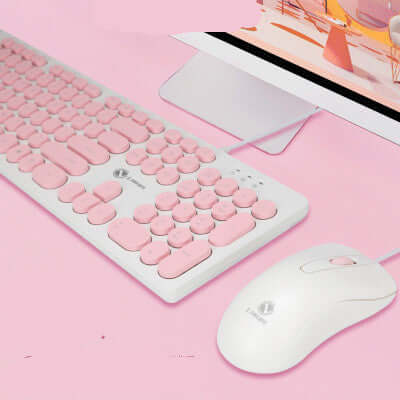Pink punk keyboard and mouse set on a pink background; USB interface, 104 keys, mute design.