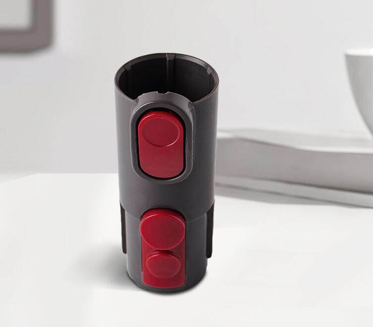 Pet grooming brush tool vacuum attachment with red buttons for easy hair removal and grooming.