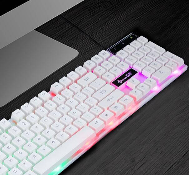 Wangtung Shanhe keyboard with angular contour, colorful backlighting on white keys, and sleek design on a dark surface.