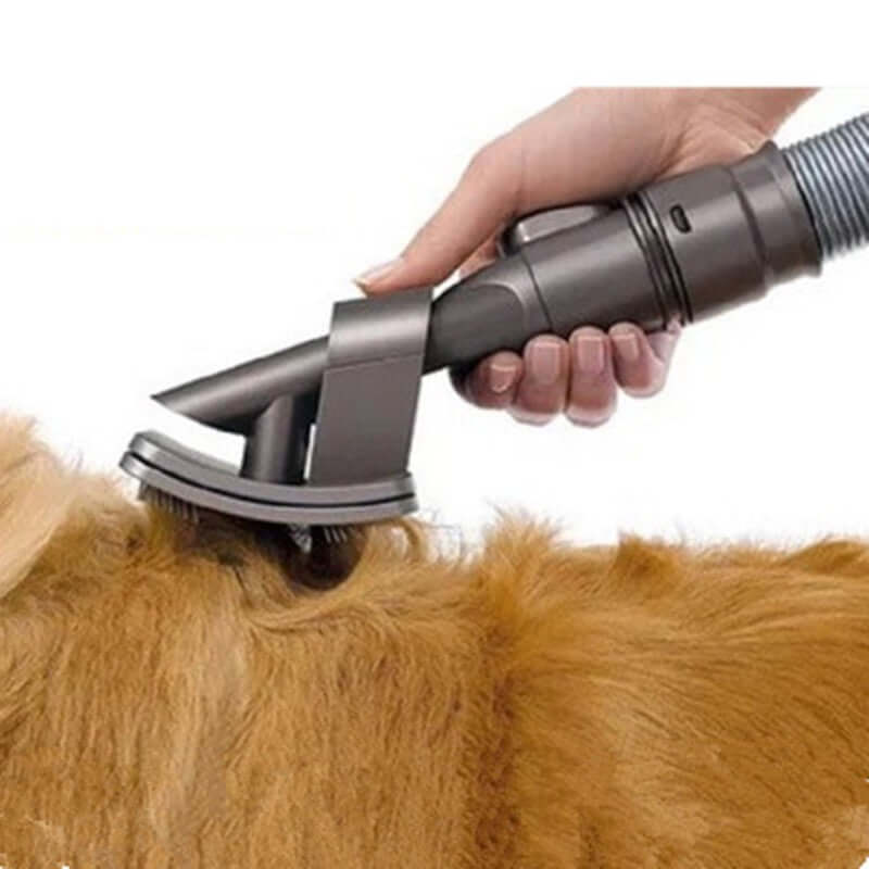 Pet grooming brush vacuum attachment removing loose fur from dog, promoting a mess-free grooming experience.