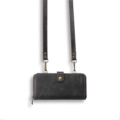 Detachable black leather wallet with strap, stylish design for carrying essentials securely.