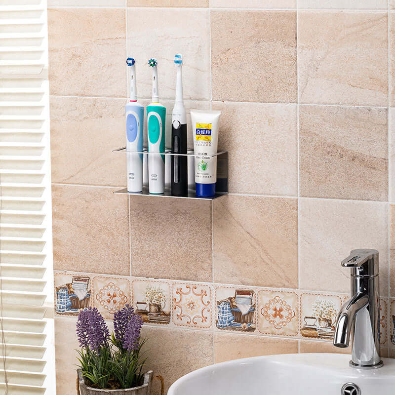 Stainless steel electric toothbrush holder mounted on bathroom wall, showcasing a sleek European design and effective organization.