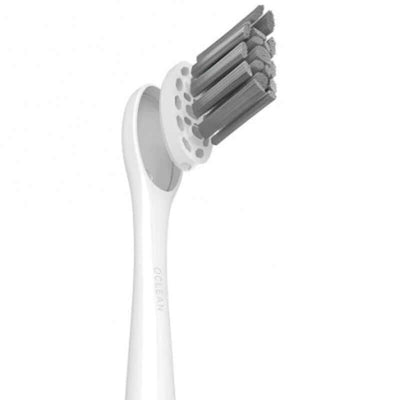 Close-up of an electric toothbrush head with multiple bristles designed for effective cleaning.
