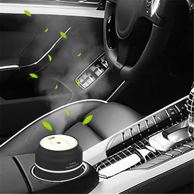Mini humidifier in car interior, releasing vapor and enhancing air quality with a sleek design.