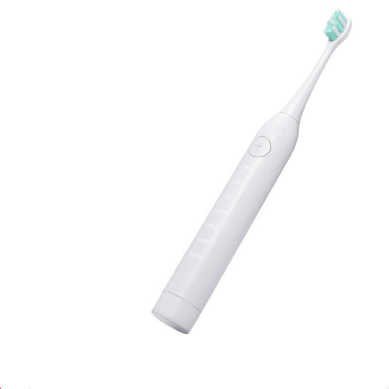 Sleek white electric toothbrush with mint green bristles, designed for effective dental cleaning and polishing.