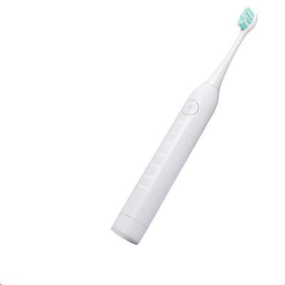Sleek white electric toothbrush with mint green bristles, designed for effective dental cleaning and polishing.