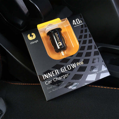 Usbright Inner Glow Pro car charger with dual USB ports, 4.0A, auto-identification feature, in an automotive setting.