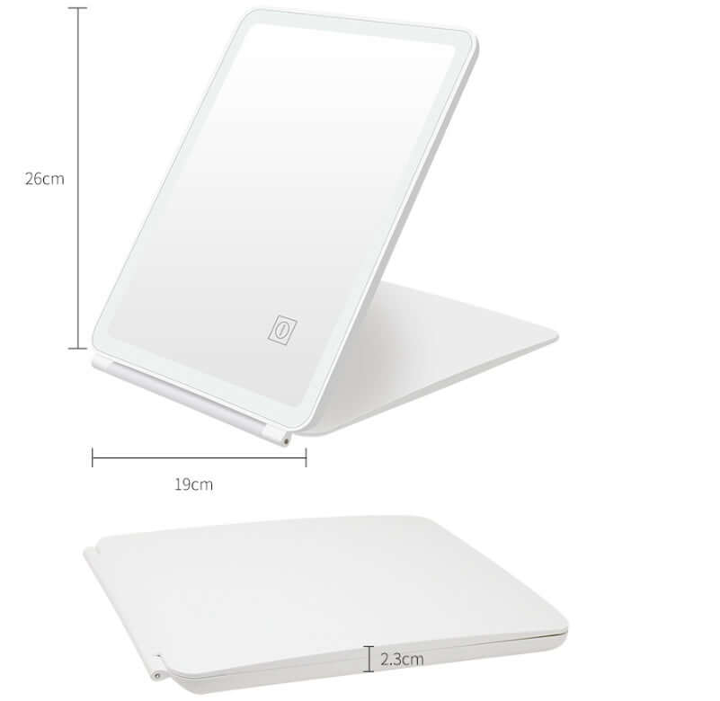 Clamshell desktop LED dressing mirror with touch control, white frame, dimensions 26x19 cm, perfect for bedrooms and bathrooms.