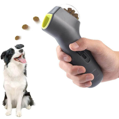 Pet Treat Launcher in use, showing a hand launching treats to a happy dog.