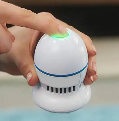 User activating a vacuum callus remover, designed for easy removal of calluses and dry skin.