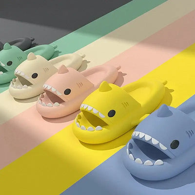 Colorful shark slides in pastel colors on a vibrant background, showcasing fun and comfort for everyday wear.