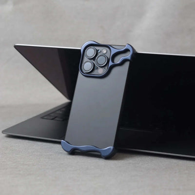 Zinc alloy protective case in Midnight Blue for iPhone 15, displayed on a laptop, showcasing minimalist style and luxury.
