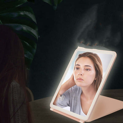 Responsive clamshell desktop LED touch dressing mirror with light, perfect for bedroom or bathroom use.
