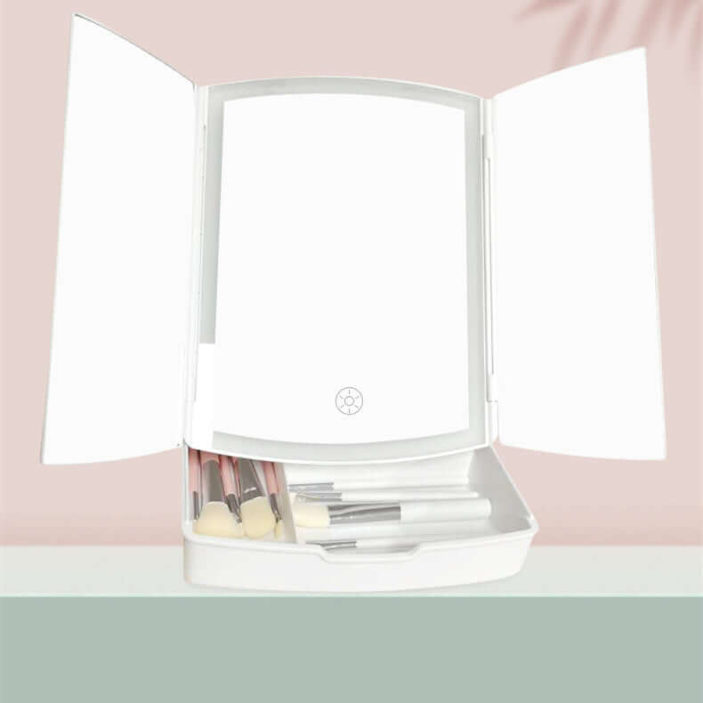 Household LED folding makeup mirror with light, white, open with brushes inside, ideal for bedroom or bathroom use.