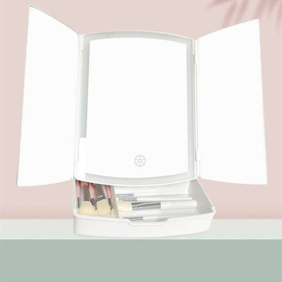 Household LED folding makeup mirror with light, white, open with brushes inside, ideal for bedroom or bathroom use.