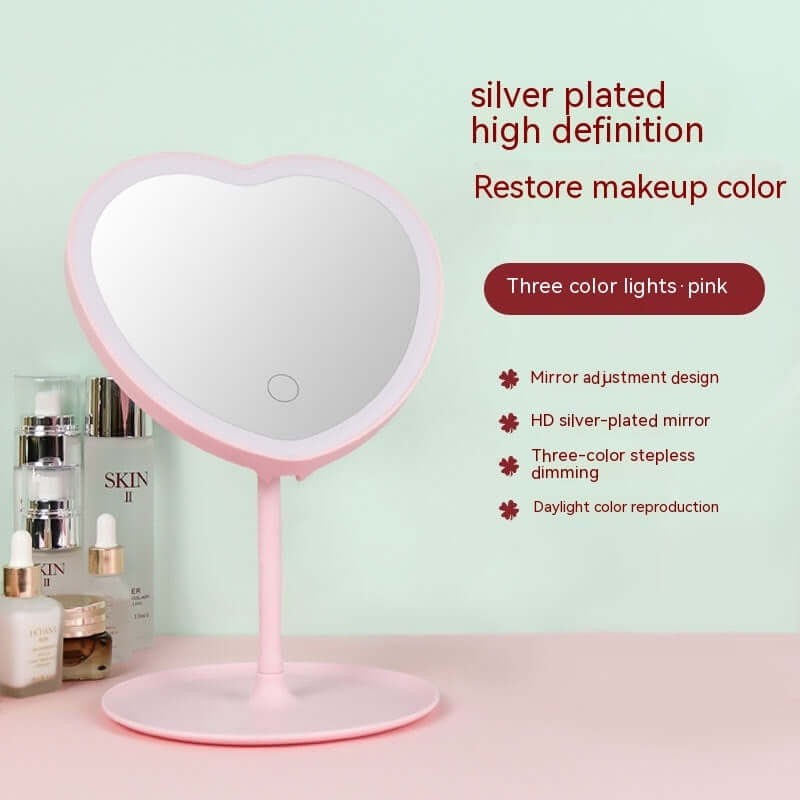 Pink heart-shaped makeup mirror with LED lights, featuring adjustable design and high-definition silver plating.