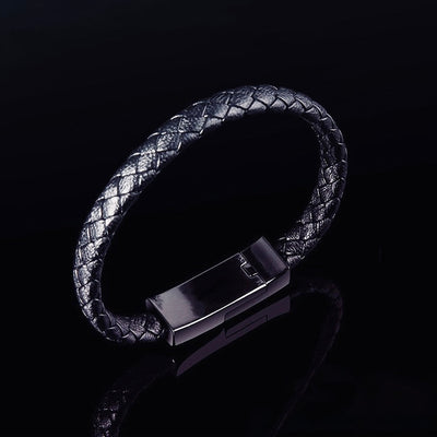 Stylish charging bracelet with a braided band, designed for on-the-go phone charging and rapid charging technology.