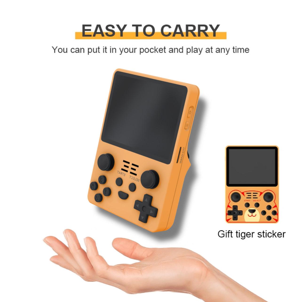 Compact orange arcade console fits in your pocket, perfect for gaming anytime. Features easy-to-use controls and included gift sticker.